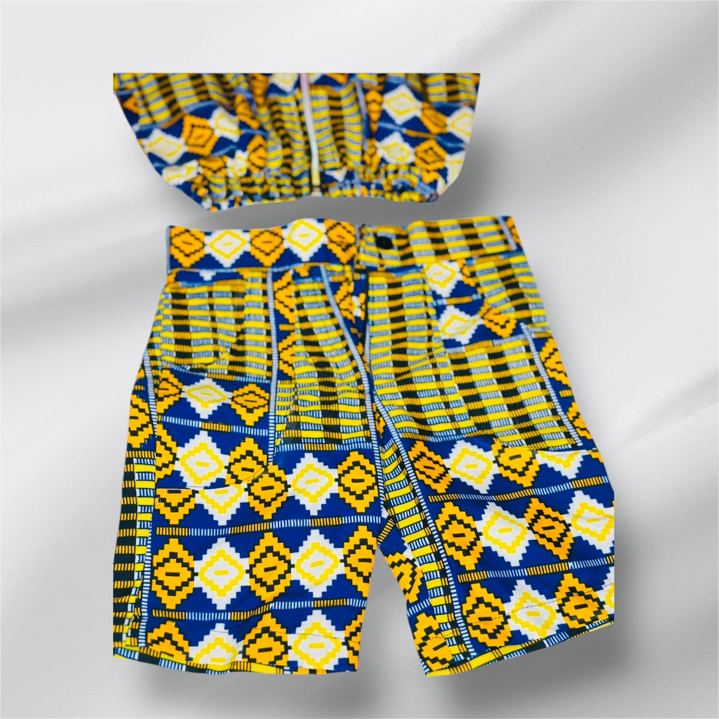 Short pants and a jacket for boys and girls 2 to three years .